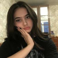 Girl resting hand on chin