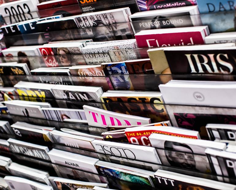A magazine rack of a myriad of magazines