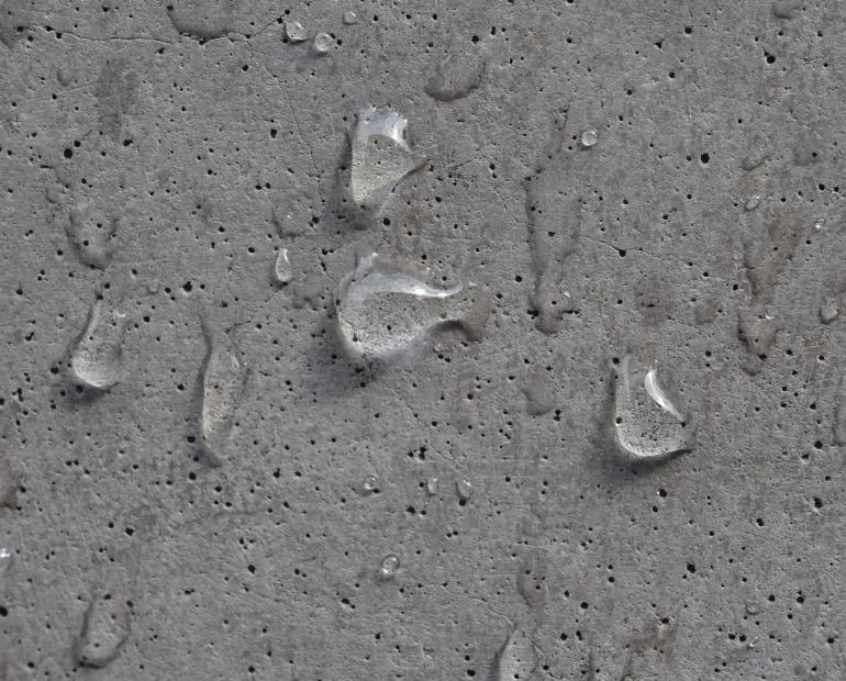 gray wall with raindrops