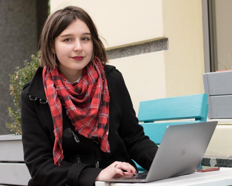 Me sitting in front of a laptop