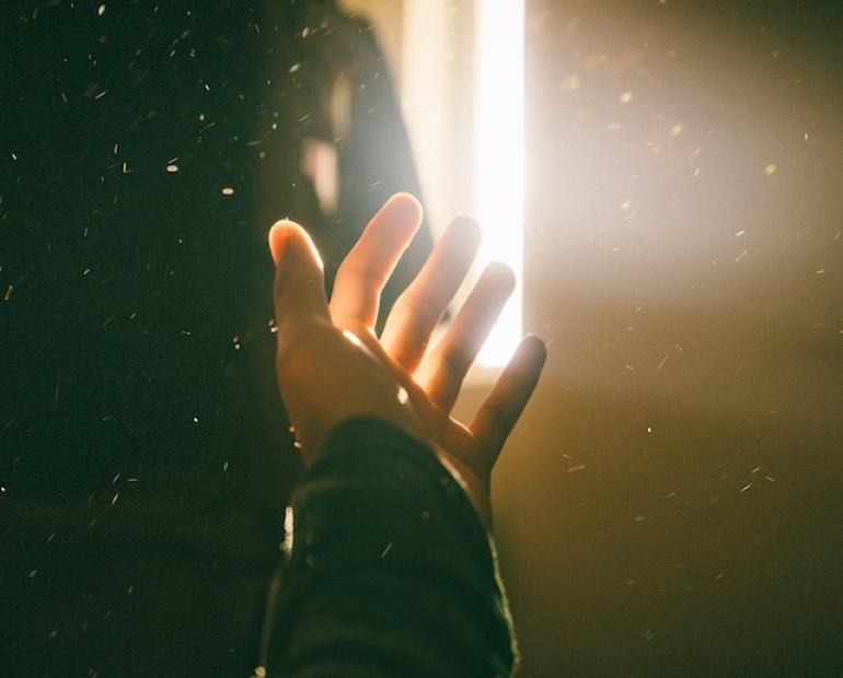 Stretch one's hand for light.