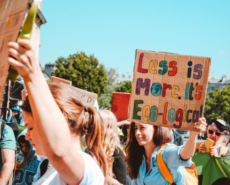 A women holding a poster 