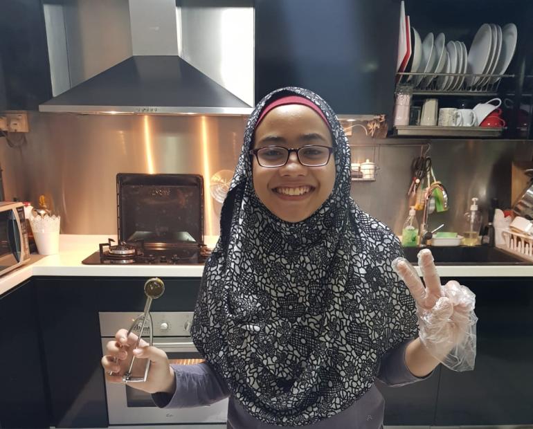 A girl baking cookies