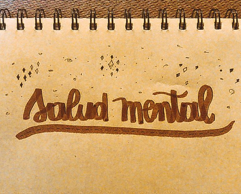 Un cuaderno que dice el tema de la columna: Salud Mental
