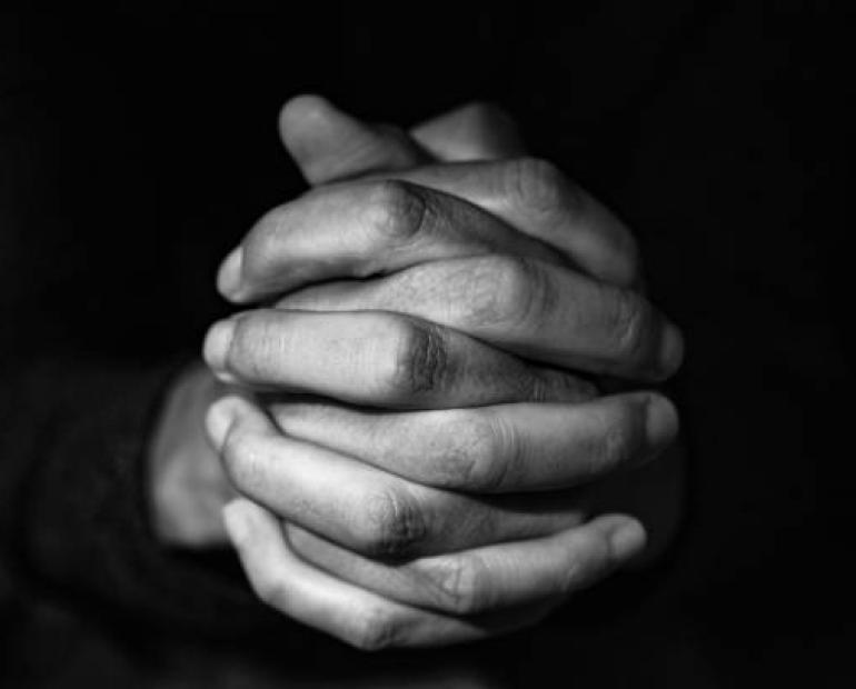 Hands clasped together