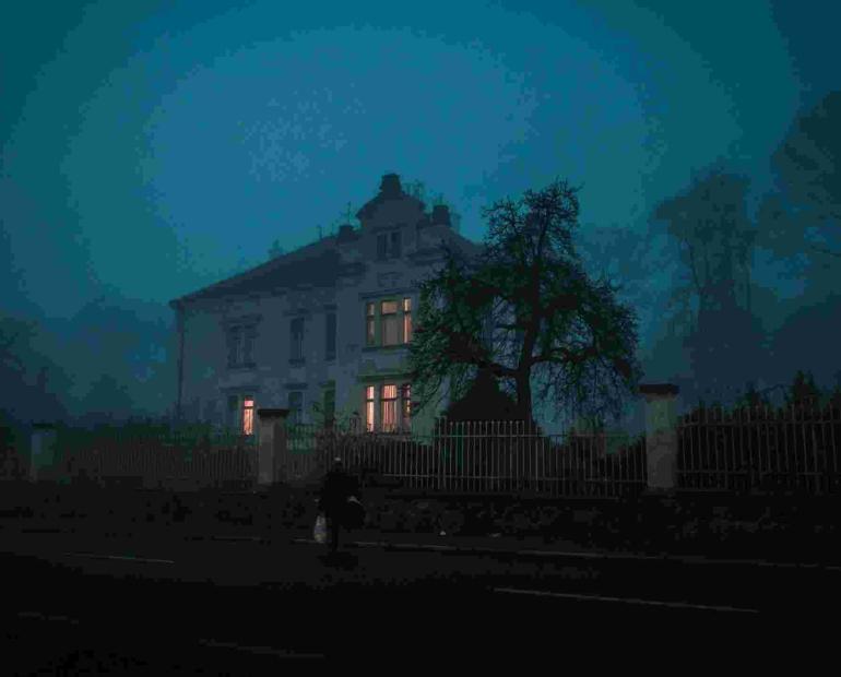 An old, eerie house at night.