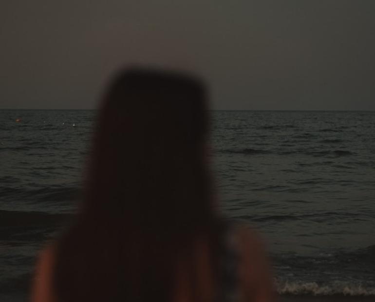 Girl standing at the beach