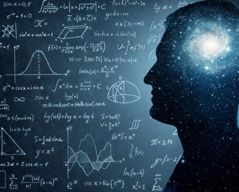 Photo edit of blackboard filed with physics problem with a man whose mind is set on exploring the universe.