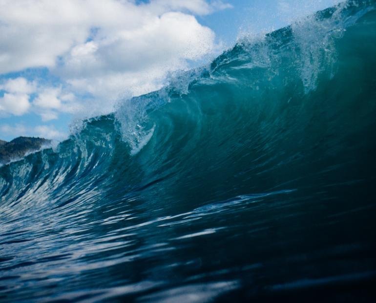 An ocean wave, blue and turqoise