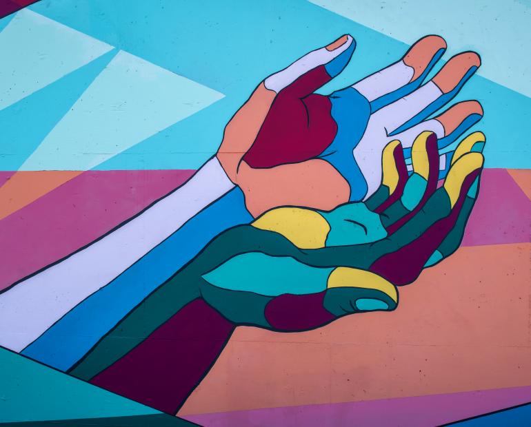 Abstract of two hands next to each other